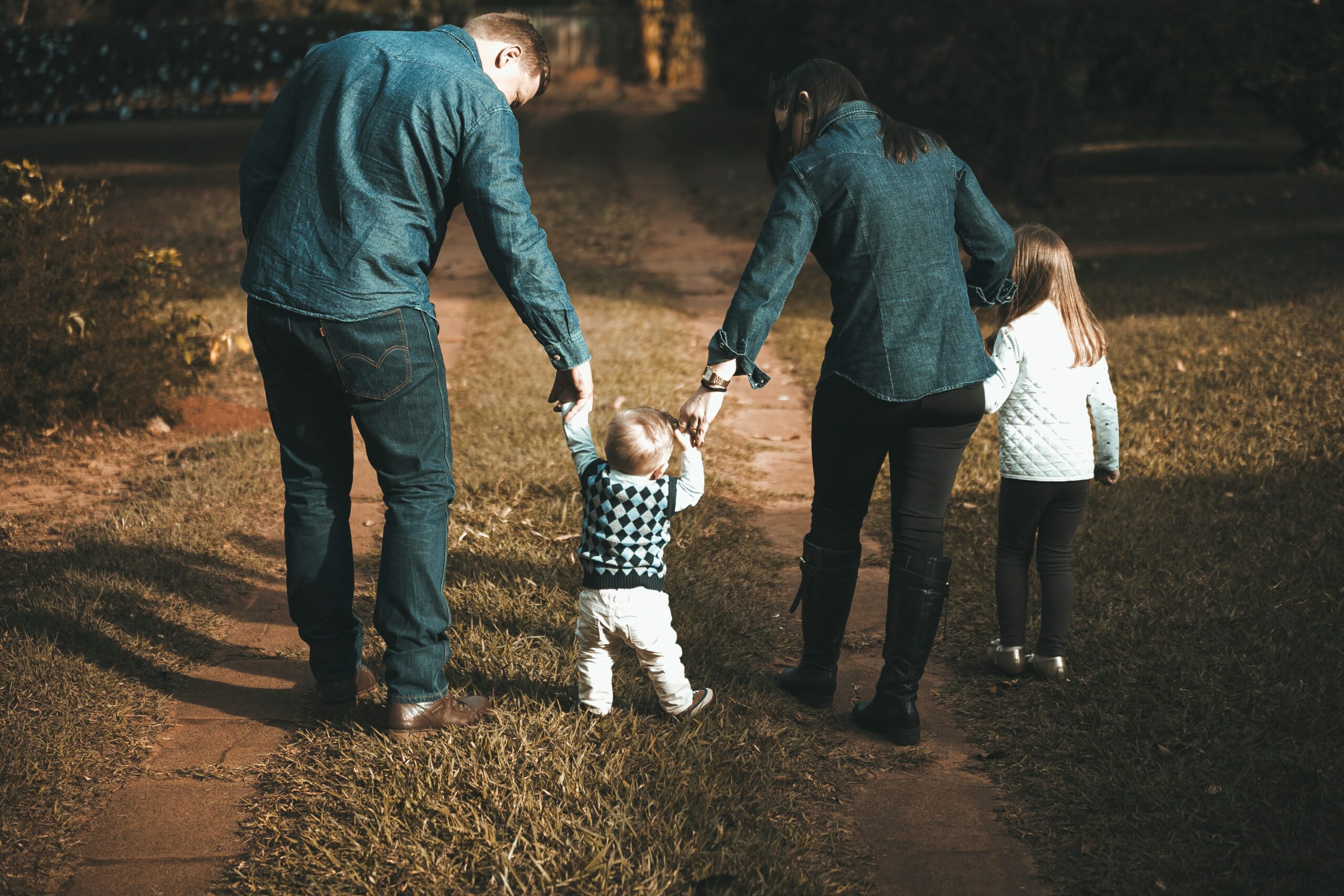 Photo by Vidal Balielo Jr.: https://www.pexels.com/photo/family-walking-on-path-1682497/